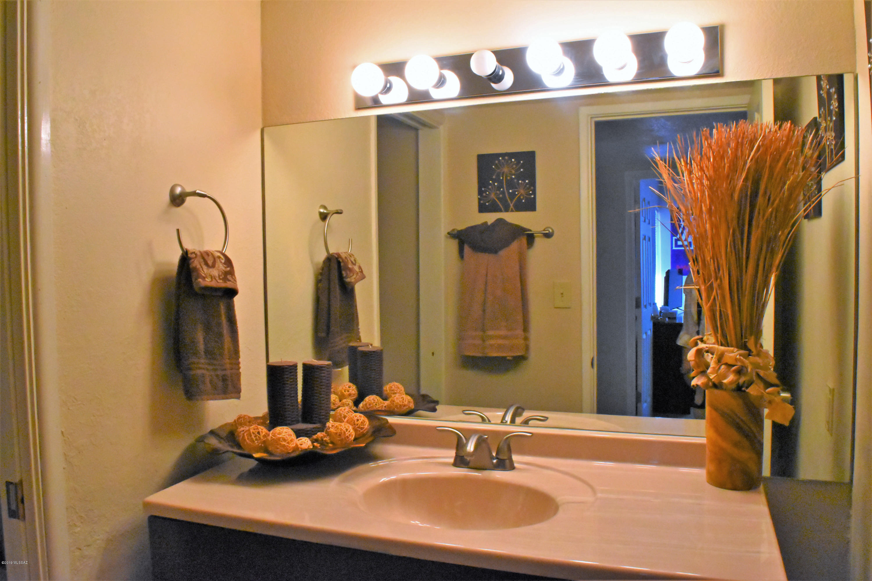 392 Willow Drive Rio Rico, AZ 85648 - Photo 18 of 25 a bathroom with a sink and a mirror