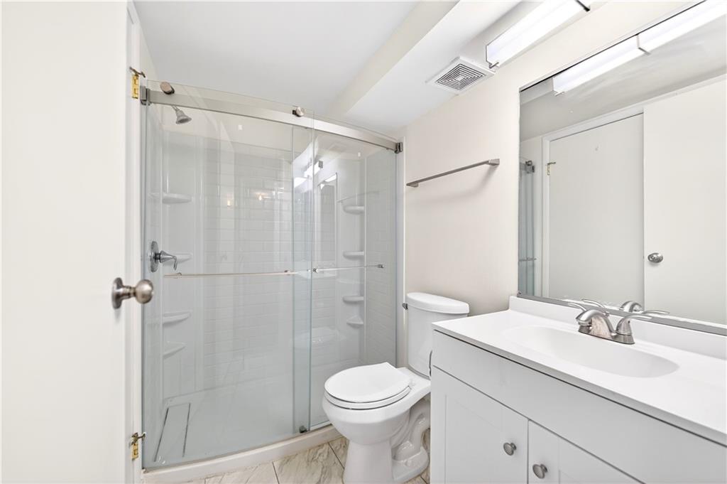 231 Coxcomb Hill Road, Unit 4 New Kensington, PA 15068 - Photo 11 of 23 a bathroom with a sink toilet and shower