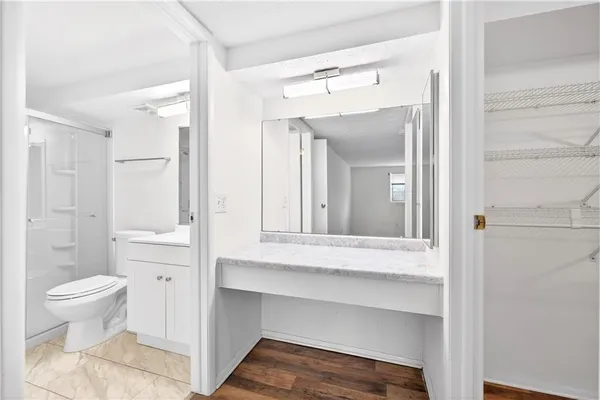 a bathroom with a sink and a large mirror