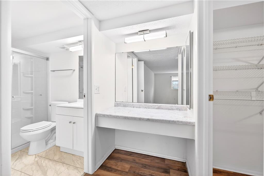 231 Coxcomb Hill Road, Unit 4 New Kensington, PA 15068 - Photo 12 of 23 a bathroom with a sink and a large mirror