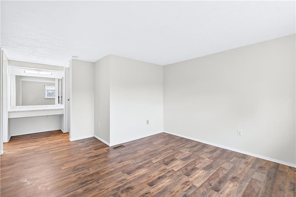 231 Coxcomb Hill Road, Unit 4 New Kensington, PA 15068 - Photo 13 of 23 a view of empty room with wooden floor and fireplace
