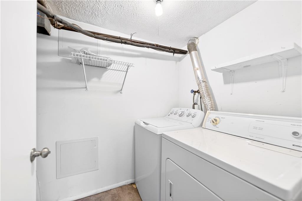 231 Coxcomb Hill Road, Unit 4 New Kensington, PA 15068 - Photo 19 of 23 a utility room with dryer and washer