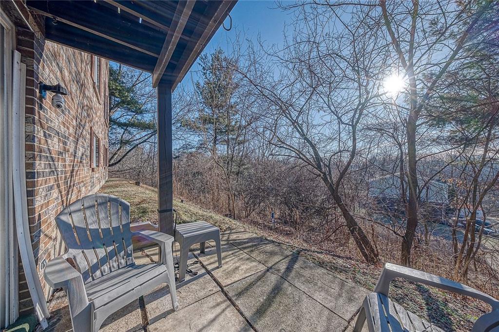 231 Coxcomb Hill Road, Unit 4 New Kensington, PA 15068 - Photo 22 of 23 a backyard of a house with outdoor seating
