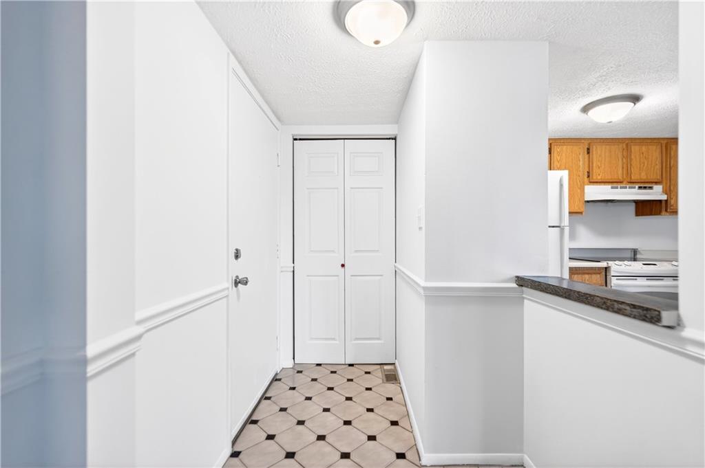 231 Coxcomb Hill Road, Unit 4 New Kensington, PA 15068 - Photo 3 of 23 a bathroom with a sink a light fixture and a shower