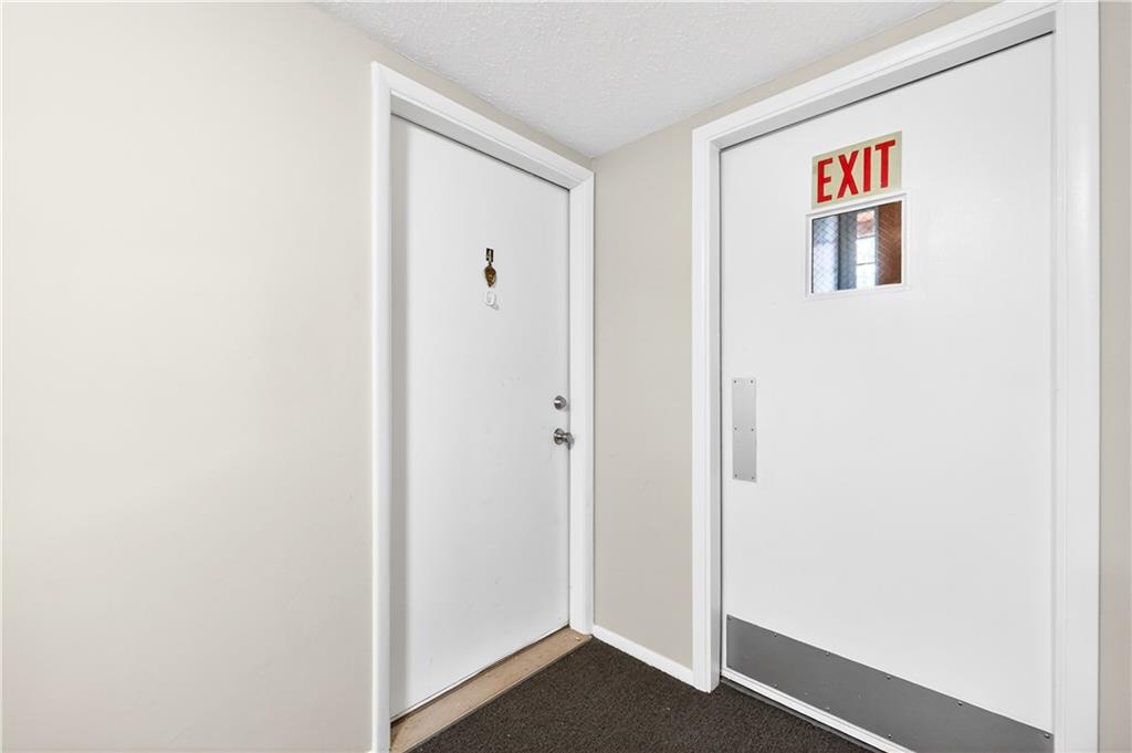 231 Coxcomb Hill Road, Unit 4 New Kensington, PA 15068 - Photo 4 of 23 a hallway with painting on the wall