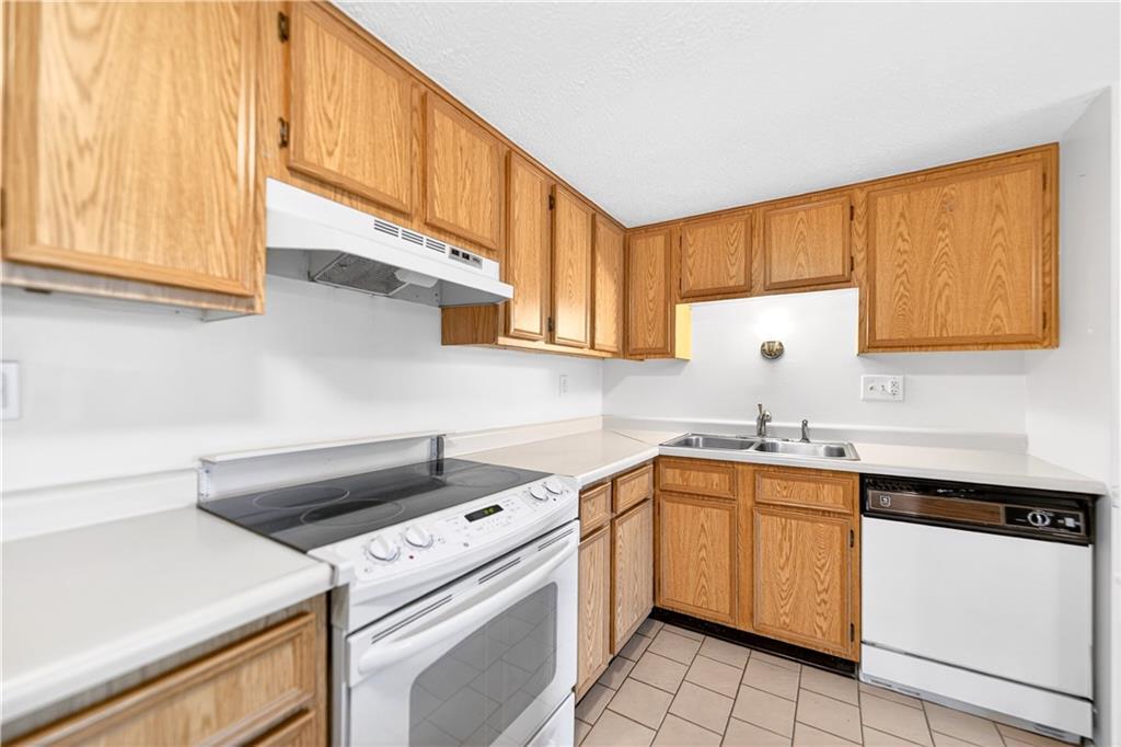 231 Coxcomb Hill Road, Unit 4 New Kensington, PA 15068 - Photo 6 of 23 a kitchen with a sink stove and cabinets