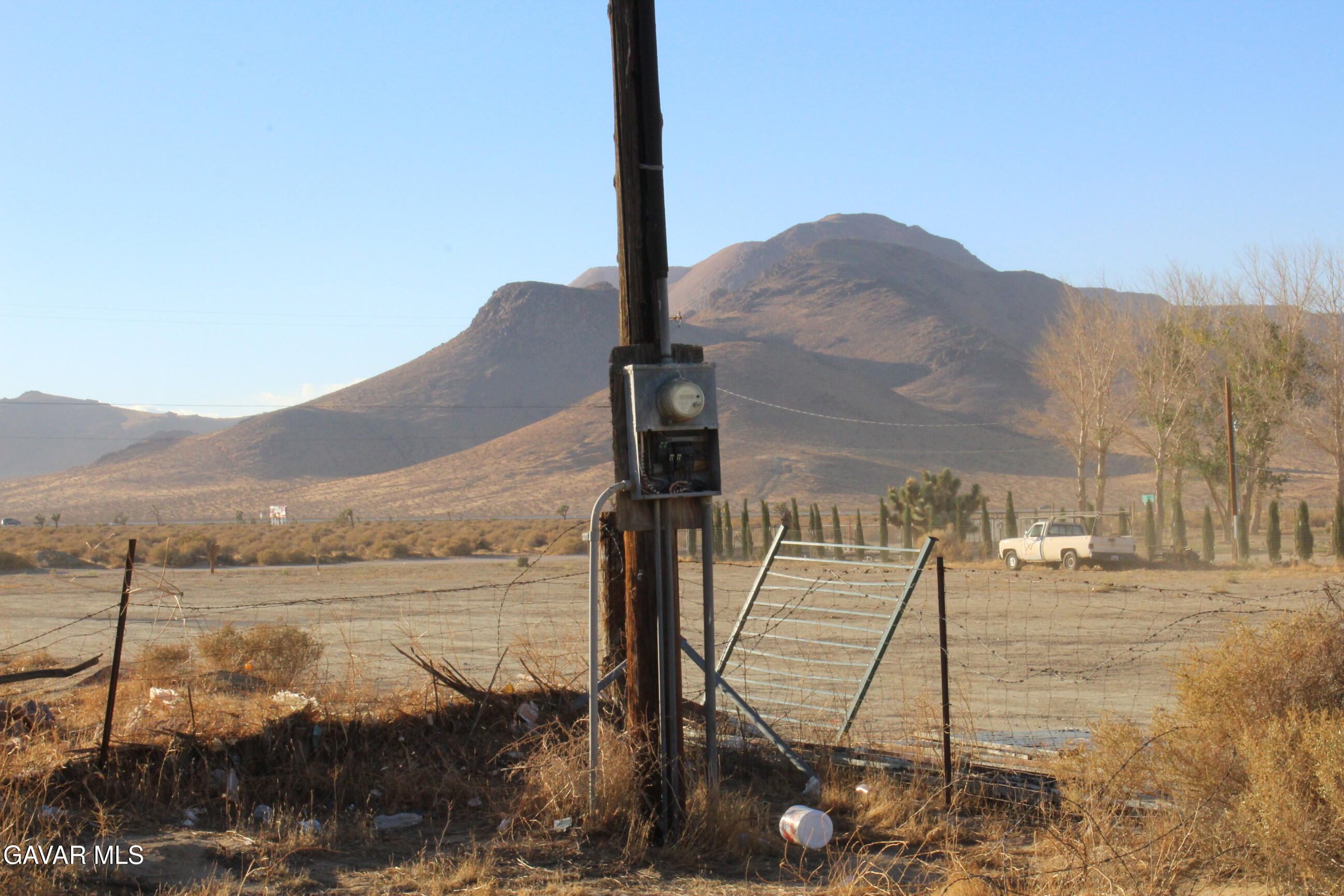 9485 Elberta Street Mojave, CA 93501 - Photo 11 of 12 a view of a lake with a mountain in the background