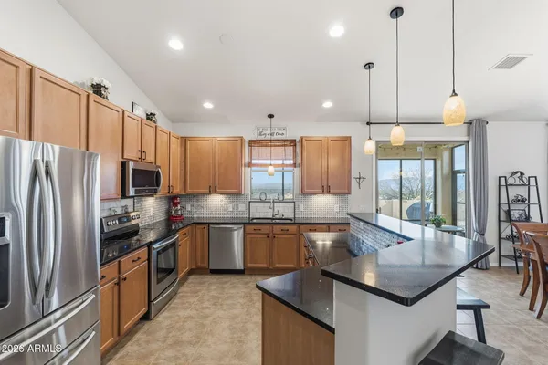 a bedroom with a bed couch and window