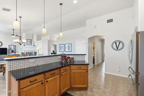 a en suite bathroom with a tub shower and sink