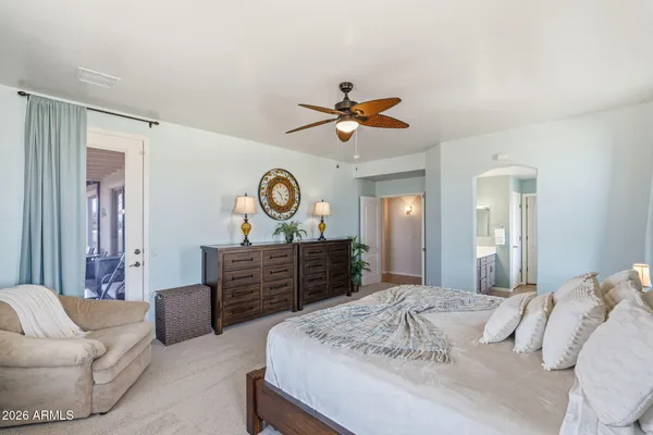 a bedroom with a bed and cabinets