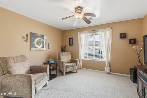 a view of a balcony with chair and front door