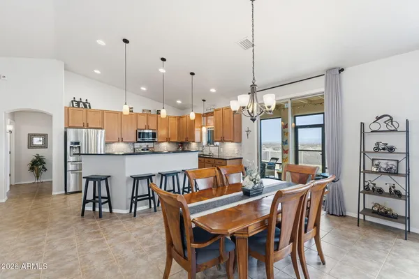 a dining room with furniture and window