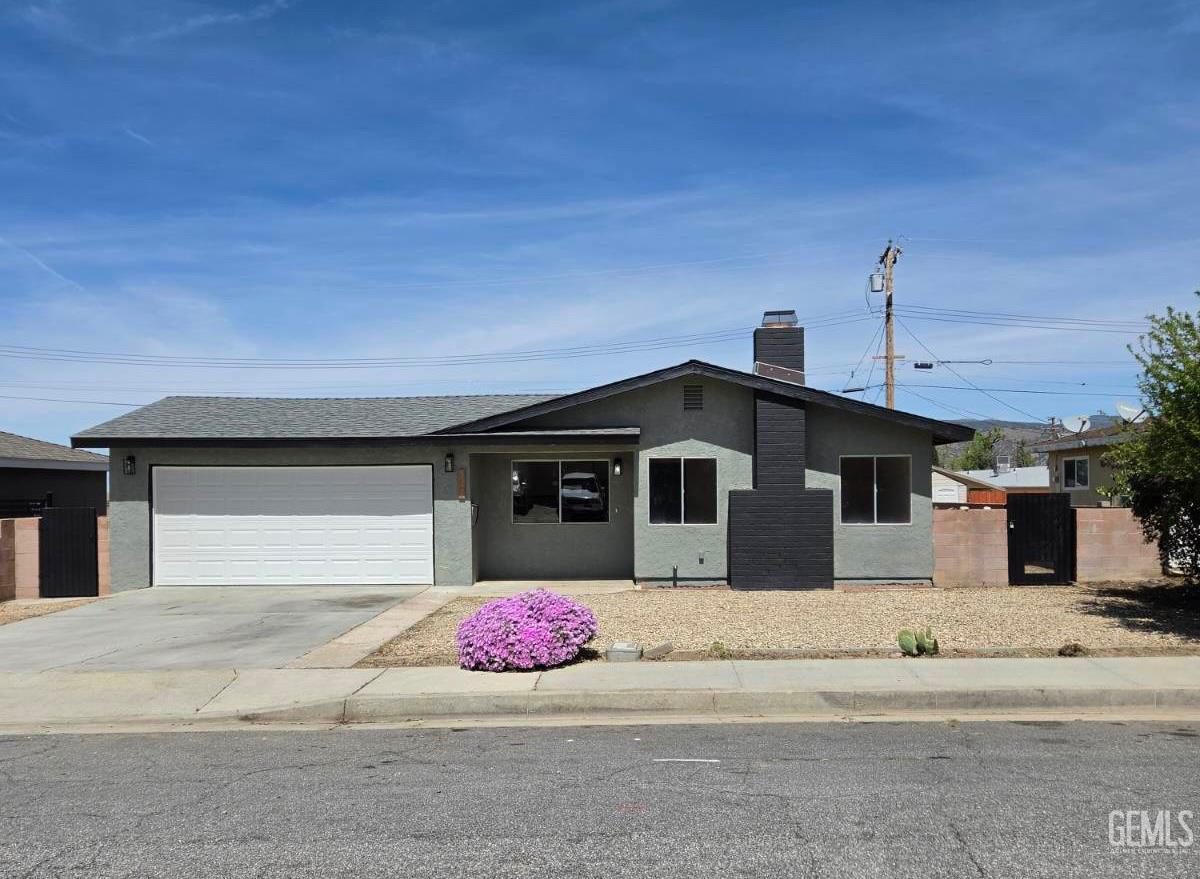 Undisclosed Address Tehachapi, CA 93561 - Photo 1 of 18 a front view of a house with a garage