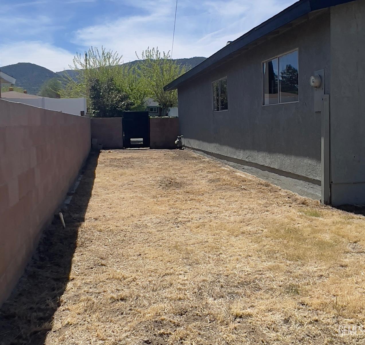 Undisclosed Address Tehachapi, CA 93561 - Photo 16 of 18 a front view of a house with a yard