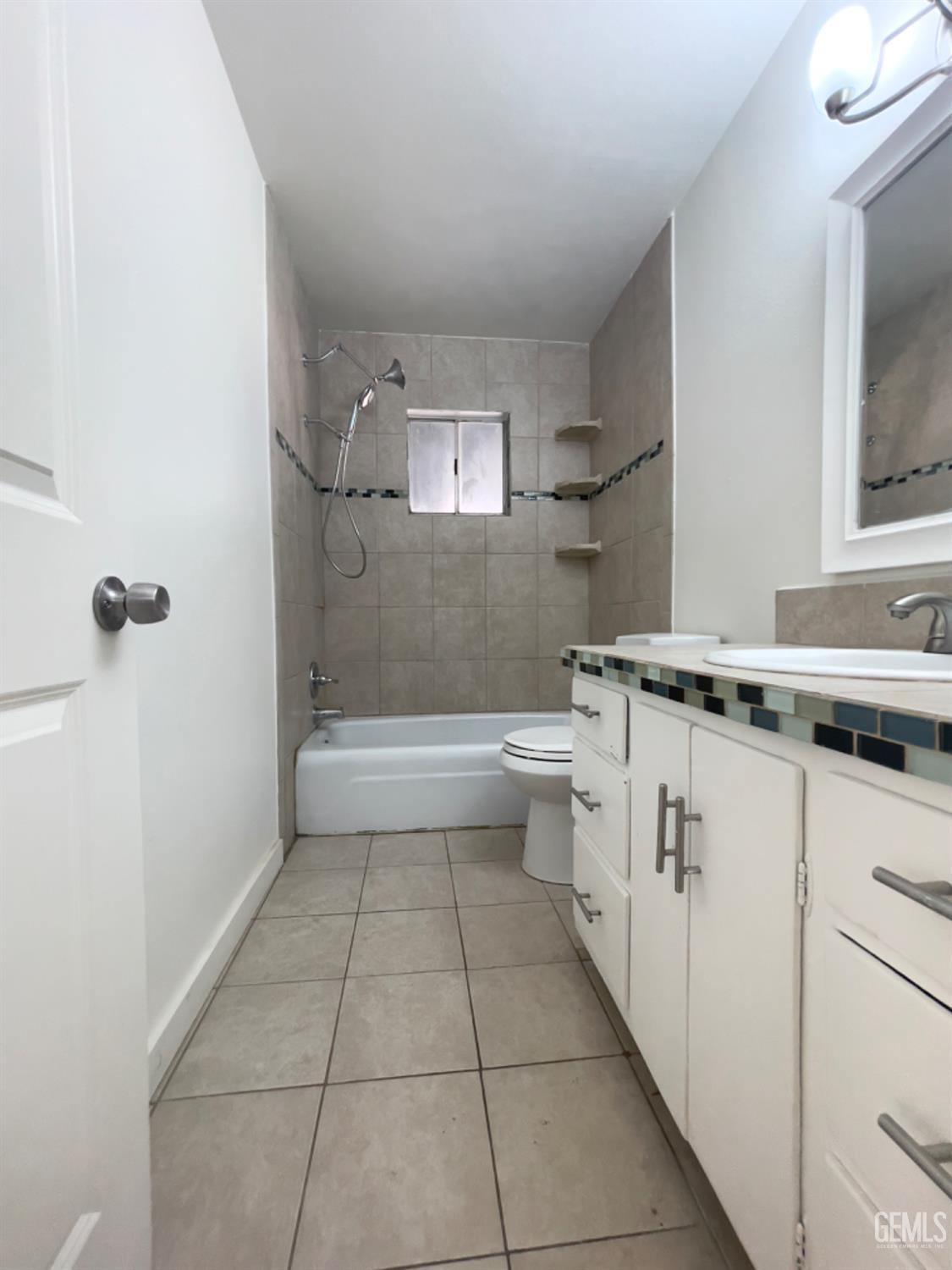 Undisclosed Address Tehachapi, CA 93561 - Photo 8 of 18 a bathroom with a granite countertop sink a toilet and shower