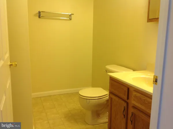 a bathroom with a toilet and a sink