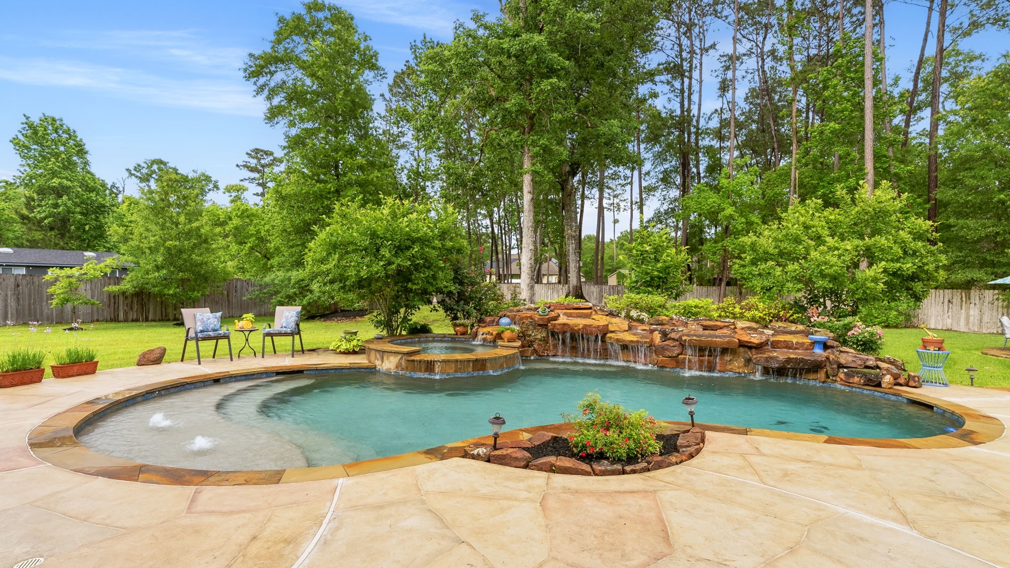 28502 Crawford Ridge Court Huffman, TX 77336 - Photo 42 of 50 a view of a swimming pool with a outdoor seating