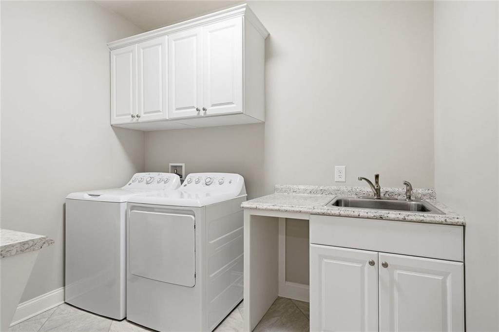 1006 Owens Store Road Canton, GA 30115 - Photo 18 of 48 a utility room with dryer and washer