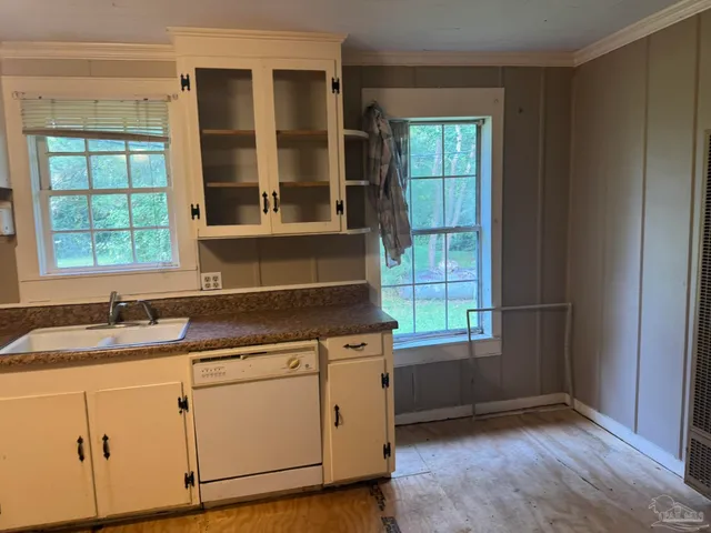 a kitchen with a sink and a window