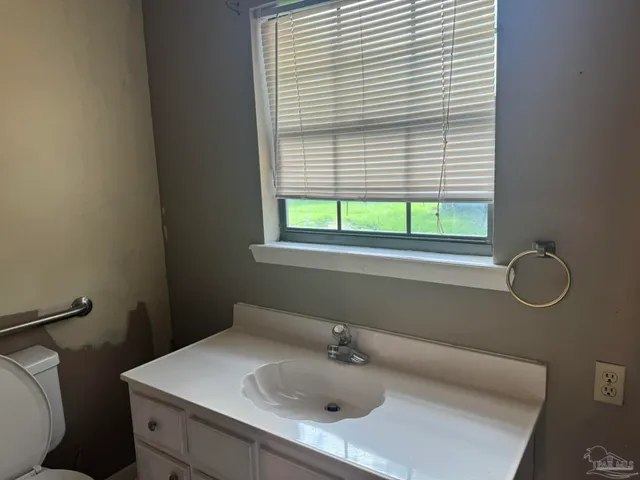 a bathroom with a sink and a toilet