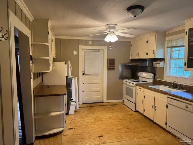 a kitchen with a refrigerator and a sink