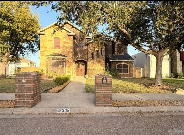 a view of a house with a street