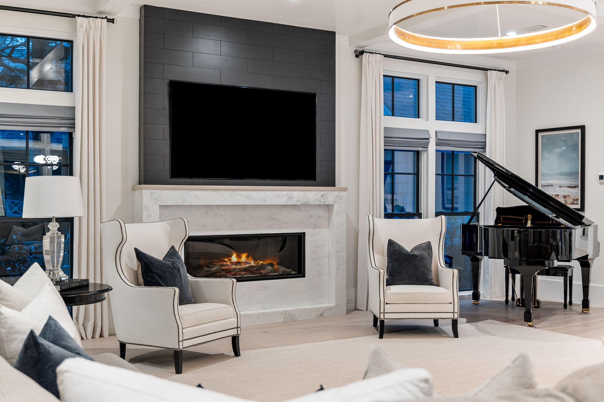 17 North Watch Tower Lane Watersound, FL 32461 - Photo 36 of 195 a living room with furniture a flat screen tv and a fireplace