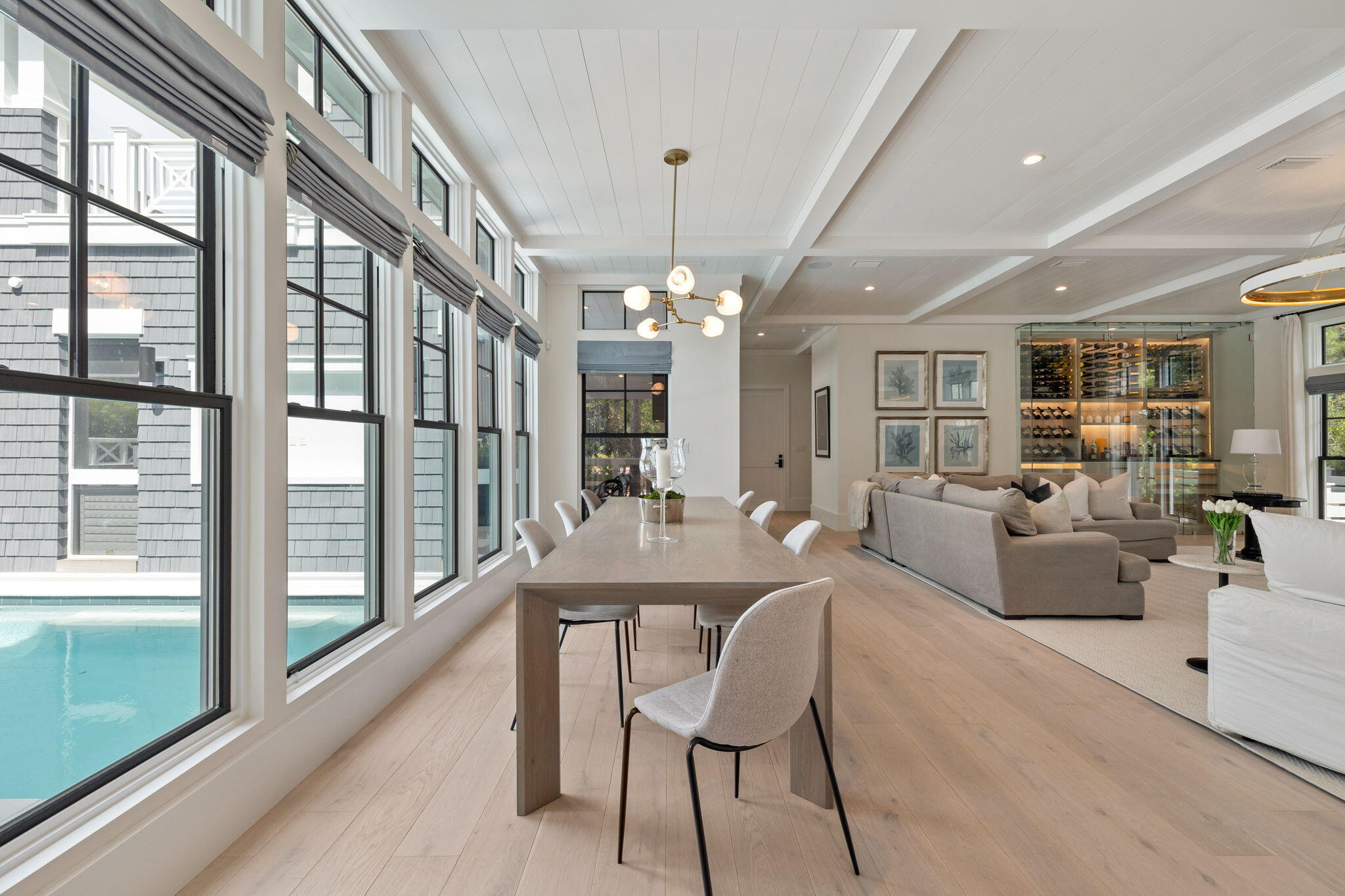 17 North Watch Tower Lane Watersound, FL 32461 - Photo 70 of 195 a living room with furniture a chandelier and a large window