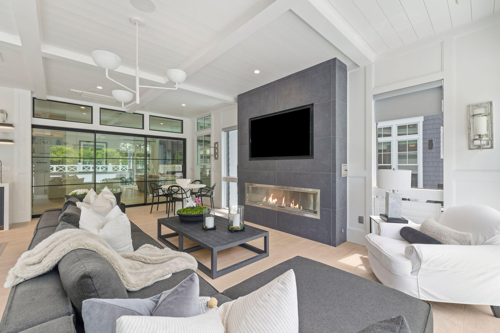 17 North Watch Tower Lane Watersound, FL 32461 - Photo 93 of 195 a living room with furniture a flat screen tv and a large window