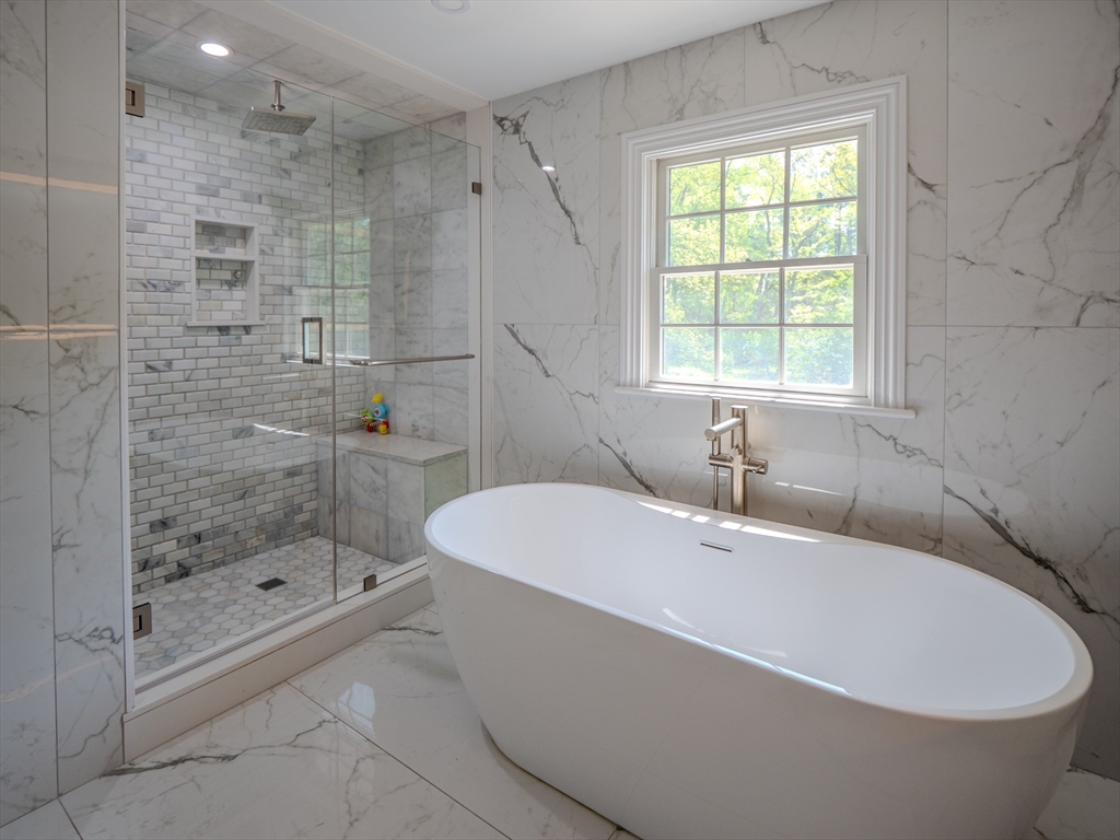 159 Mishawum Road Woburn, MA 01801 - Photo 16 of 41 a white bath tub sitting next to a shower