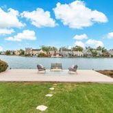 a view of a lake with houses in the back