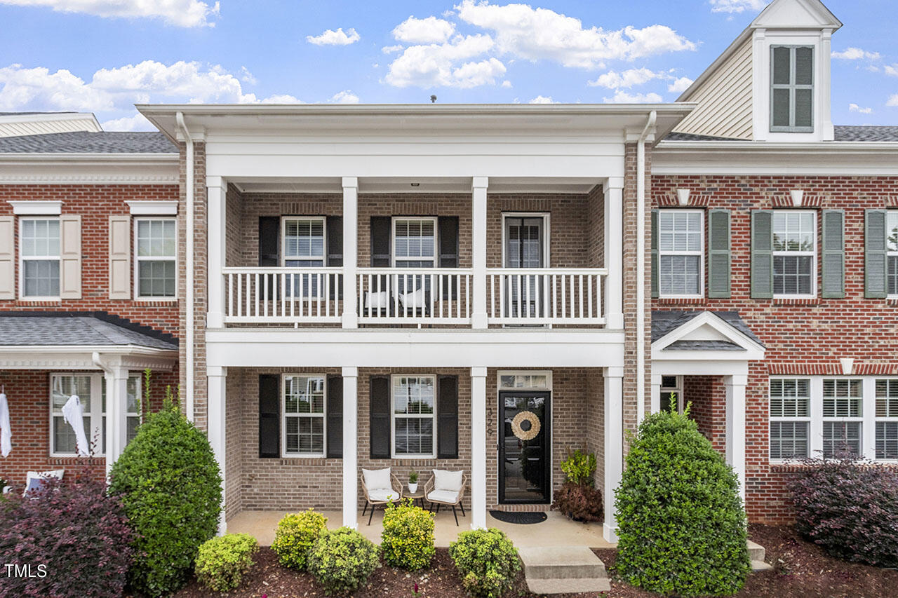 1329 Still Monument Way Raleigh, NC 27603 - Photo 1 of 42 front view of a brick house with a large windows