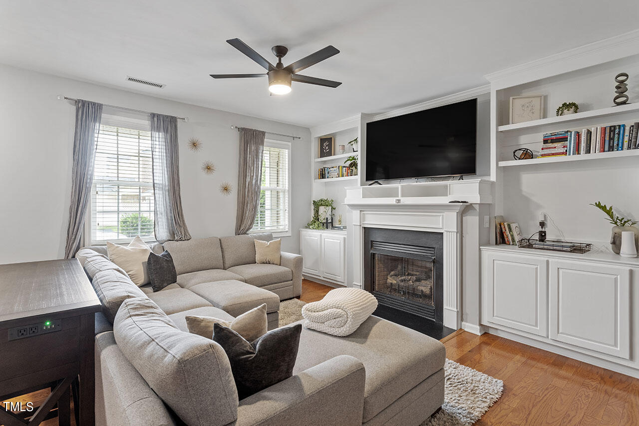 1329 Still Monument Way Raleigh, NC 27603 - Photo 12 of 42 a living room with furniture fireplace and flat screen tv