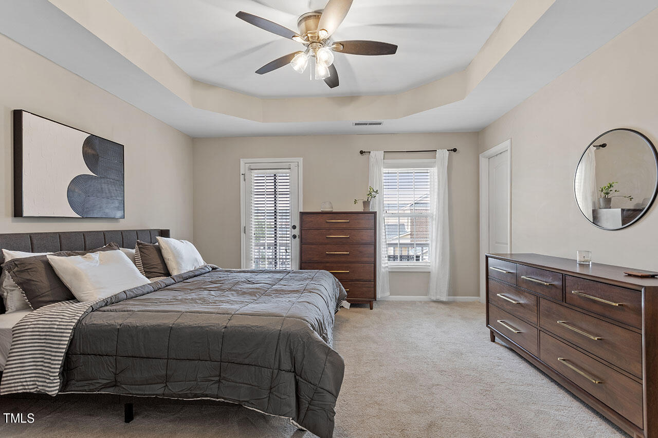 1329 Still Monument Way Raleigh, NC 27603 - Photo 21 of 42 a bedroom with a bed and a dresser