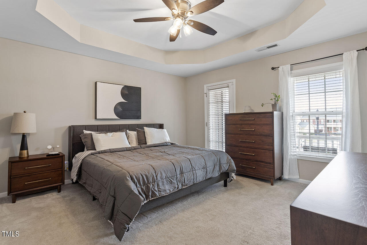 1329 Still Monument Way Raleigh, NC 27603 - Photo 3 of 42 a bedroom with a bed dresser and a window