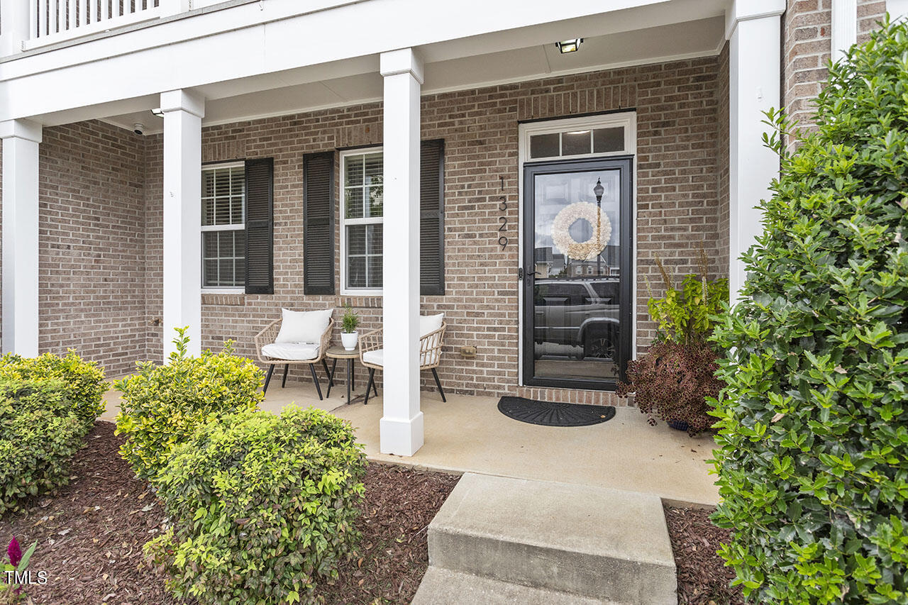 1329 Still Monument Way Raleigh, NC 27603 - Photo 7 of 42 a front view of a house with a yard