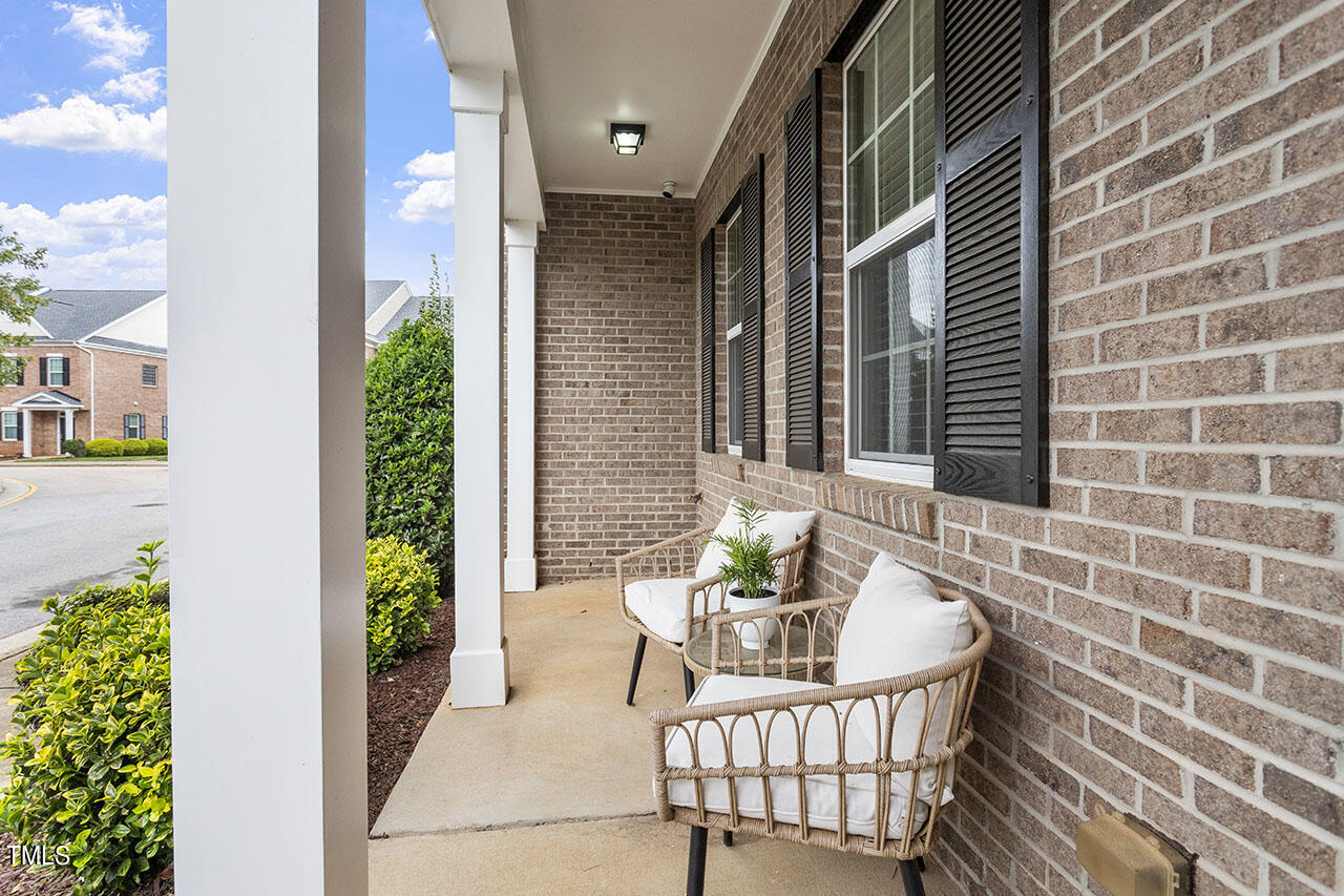 1329 Still Monument Way Raleigh, NC 27603 - Photo 8 of 42 a view of a balcony and dining table and chairs