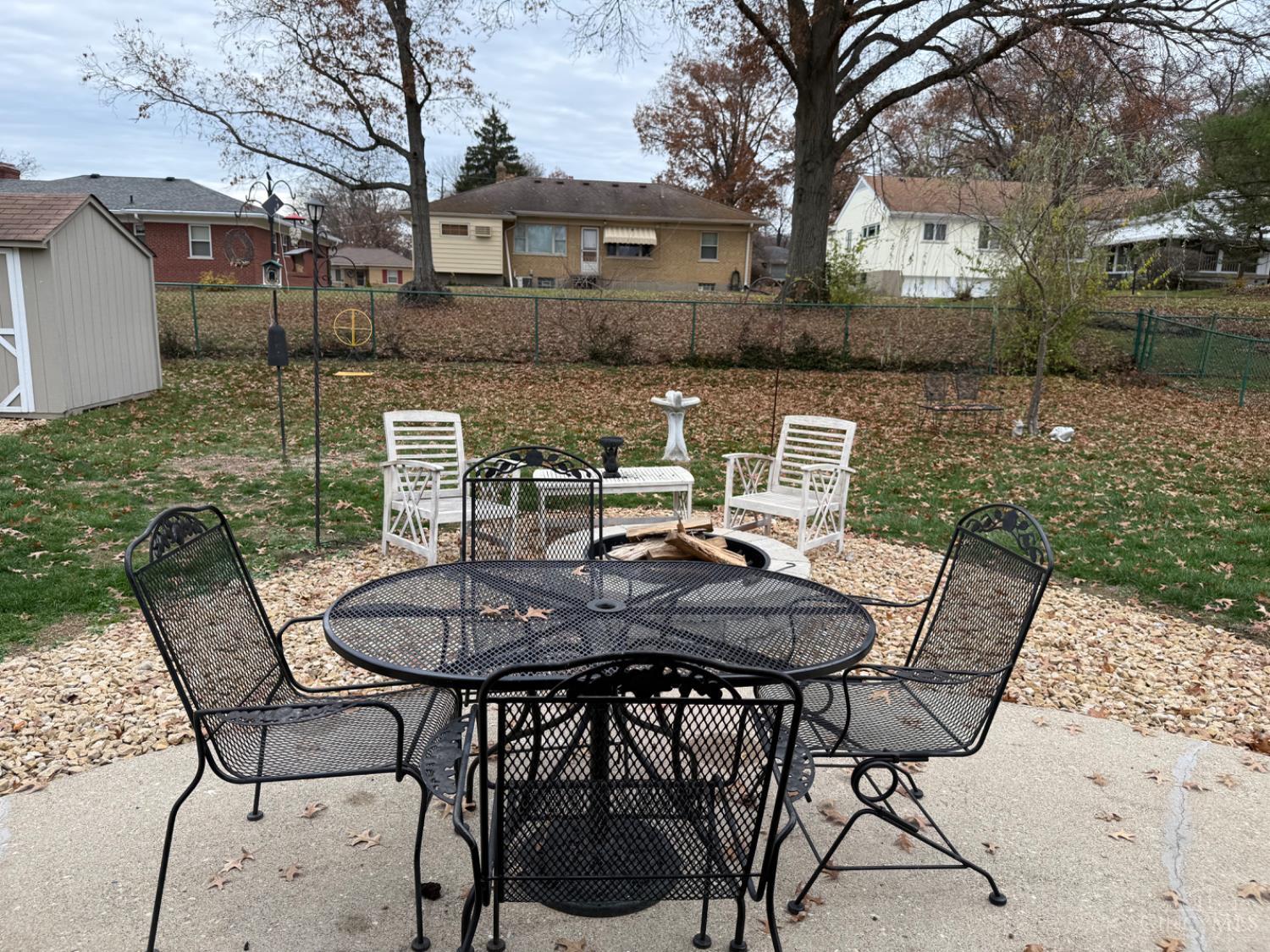 1818 Linneman Road Cincinnati, OH 45238 - Photo 53 of 62 Rocks were added just beyond the patio, along with the firepit in 2022. A french drain was also installed at that time