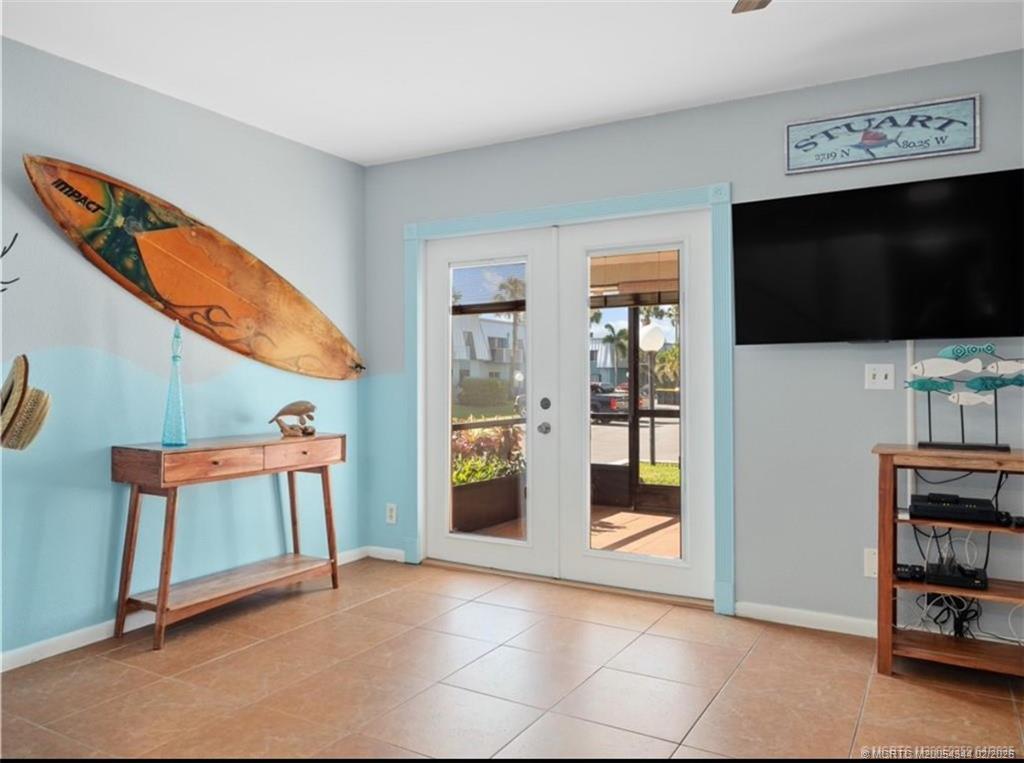 950 South Kanner Highway, Unit TH138 Stuart, FL 34994 - Photo 4 of 7 a view of an empty room with working space and a window