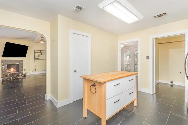 a kitchen with a stove and a refrigerator