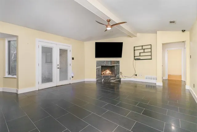 a view of livingroom with furniture fireplace and flat screen tv