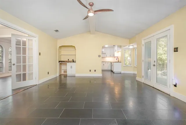 a view of a kitchen with a sink and a window