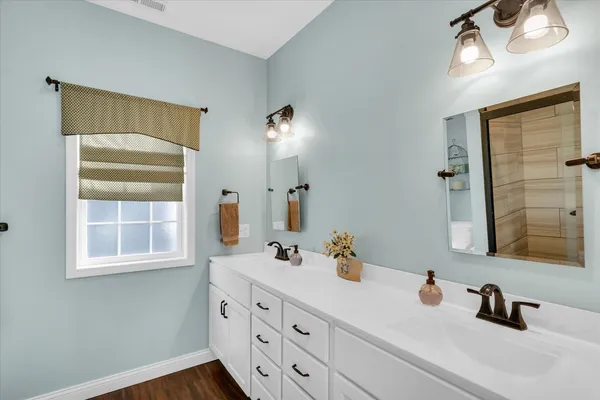 a bathroom with a sink and a mirror