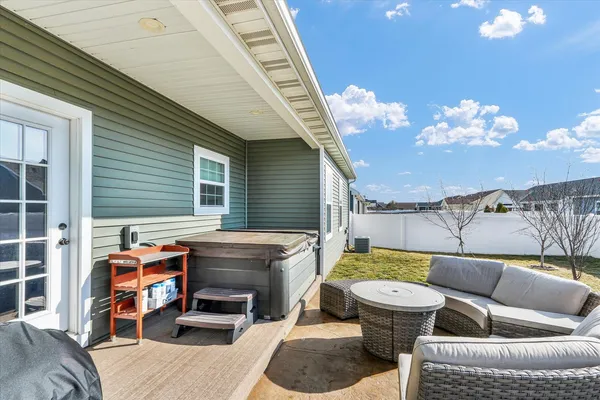 a backyard of a house with outdoor seating
