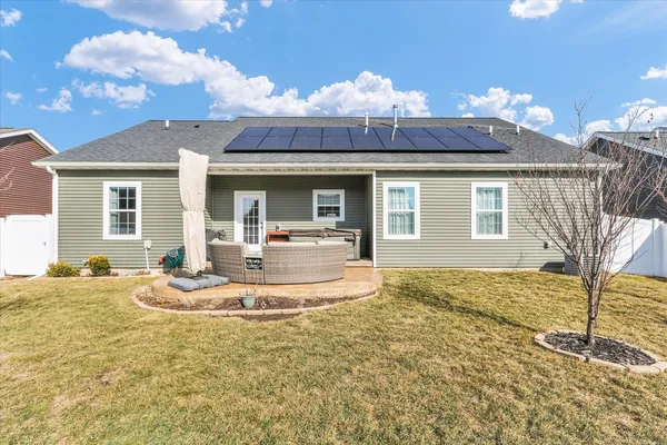 a view of a house with a yard