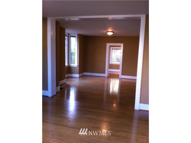 4001 Whitman Avenue North Seattle, WA 98103 - Photo 4 of 8 a view of a hallway with wooden floor