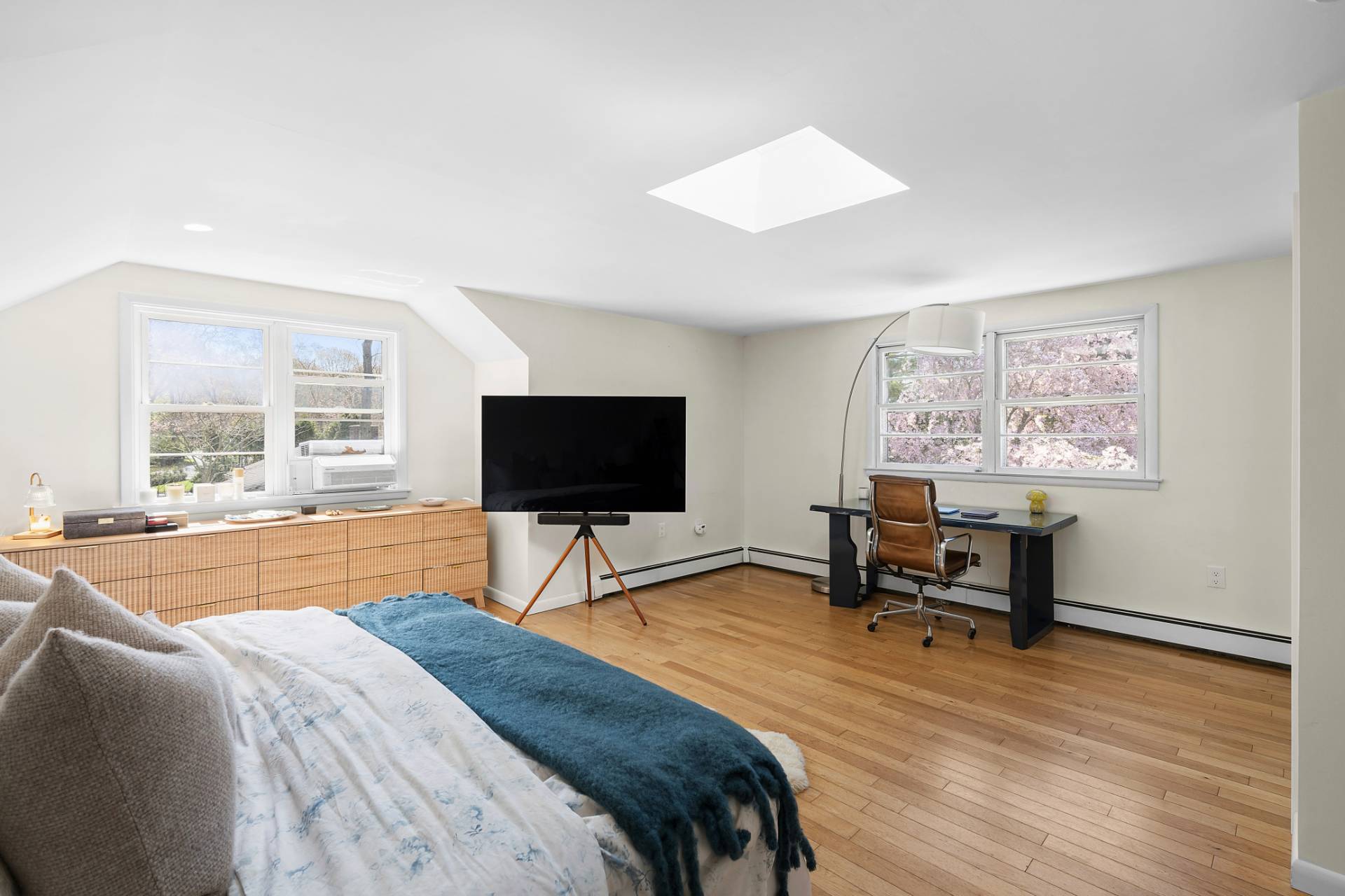 10 Glade Road East Hampton, NY 11937 - Photo 6 of 10 a bedroom with a bed and a flat screen tv