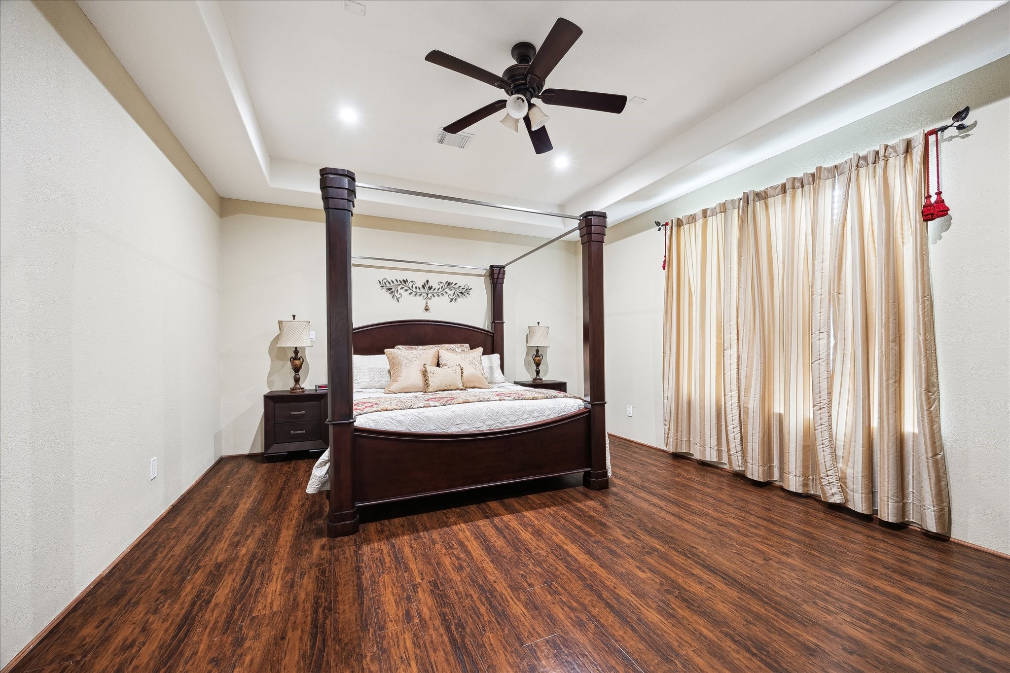 8917 Hawk Road Pearland, TX 77584 - Photo 12 of 33 a bedroom with a bed and wooden floor