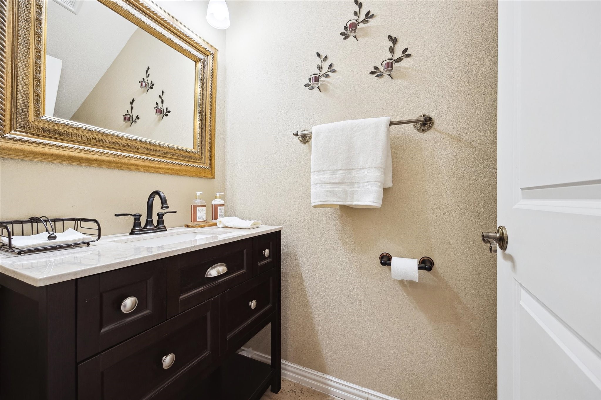 8917 Hawk Road Pearland, TX 77584 - Photo 21 of 33 a bathroom with a sink vanity and mirror