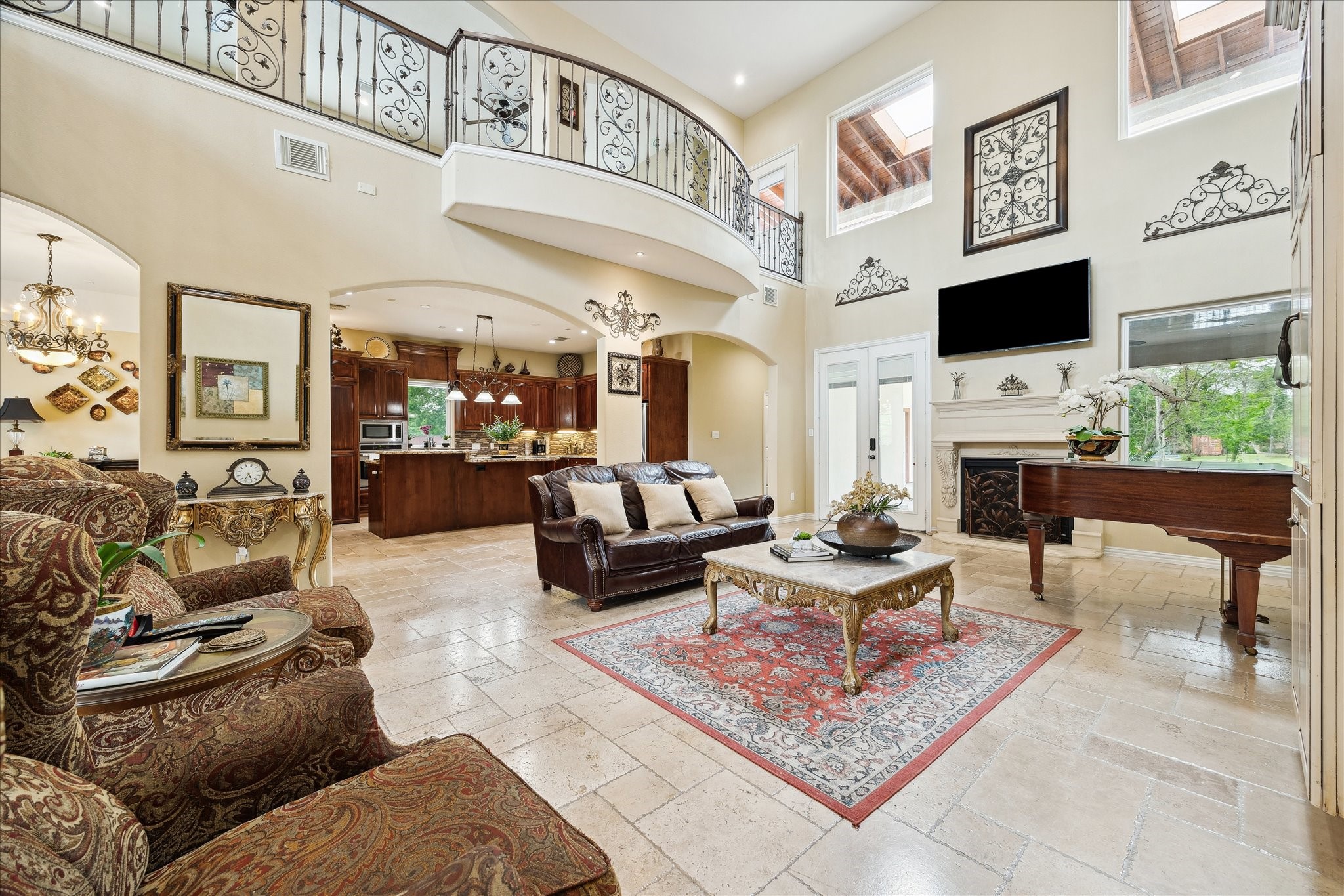 8917 Hawk Road Pearland, TX 77584 - Photo 7 of 33 a living room with furniture a flat screen tv and a table